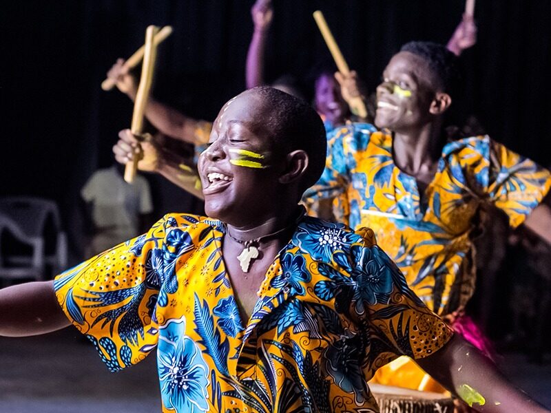 Young musicians and dancers performing with Dance of Hope from Uganda